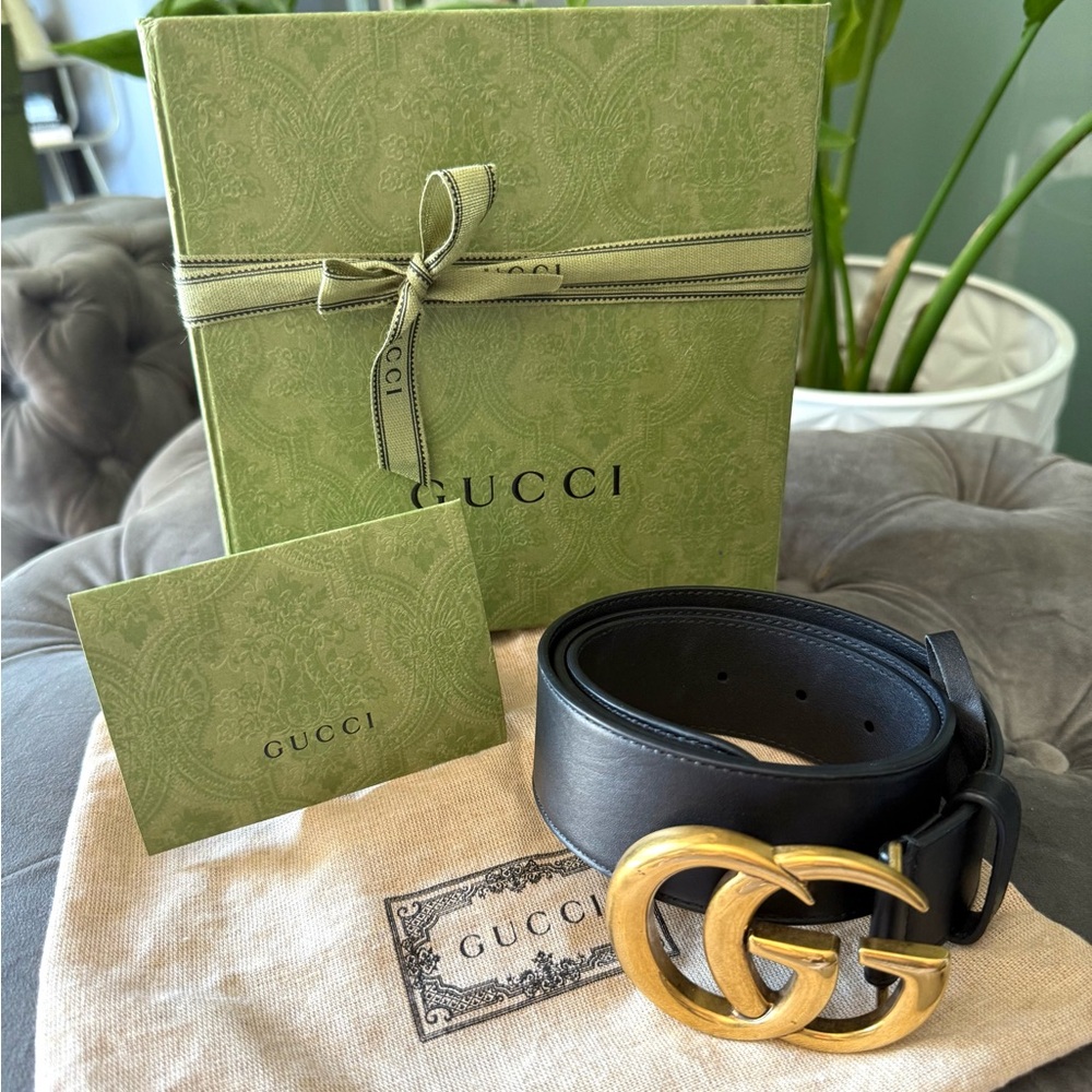 Gucci Black and Gold Belt with Iconic GG Buckle